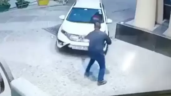 Rape accused hits security guard with car in Noida society, flees | Video(ANI) Rape accused hits security guard with car in Noida society, flees | Video(ANI)