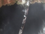 This satellite image released by Maxar Technologies shows the northern span of the damaged Antonovskiy bridge, in Kherson, Ukraine, on Friday