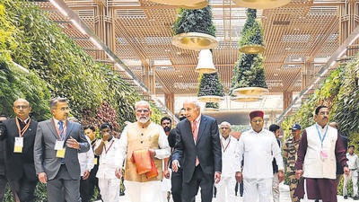 Prime Minister Narendra Modi with Union minister Pralhad Joshi, Karnataka Governor Thaawarchand Gehlot and others at the newly inaugurated Terminal 2 of Kempegowda International Airport, in Bengaluru on Friday. (PTI) Prime Minister Narendra Modi with Union minister Pralhad Joshi, Karnataka Governor Thaawarchand Gehlot and others at the newly inaugurated Terminal 2 of Kempegowda International Airport, in Bengaluru on Friday. (PTI)
