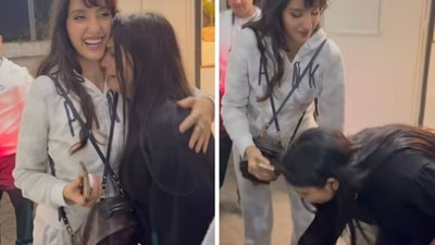 Nora Fatehi's fan gets emotional and touches her feet. Nora Fatehi's fan gets emotional and touches her feet.