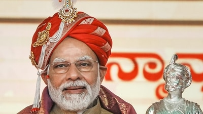 Bengaluru: Prime Minister Narendra Modi being presented a memento during a public meeting after the inauguration of Terminal 2 of Kempegowda International Airport. (PTI) Bengaluru: Prime Minister Narendra Modi being presented a memento during a public meeting after the inauguration of Terminal 2 of Kempegowda International Airport. (PTI)