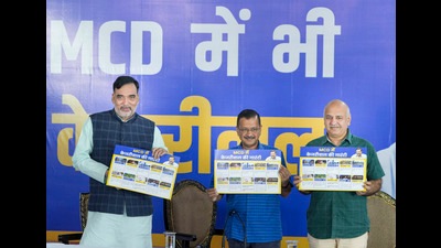 Delhi Chief Minister Arvind Kejriwal with Deputy Chief Minister Manish Sisodia and Delhi Environment Minister Gopal Rai release the party manifesto ahead of the upcoming MCD polls, during a press conference, in New Delhi on Friday. (PTI) Delhi Chief Minister Arvind Kejriwal with Deputy Chief Minister Manish Sisodia and Delhi Environment Minister Gopal Rai release the party manifesto ahead of the upcoming MCD polls, during a press conference, in New Delhi on Friday. (PTI)