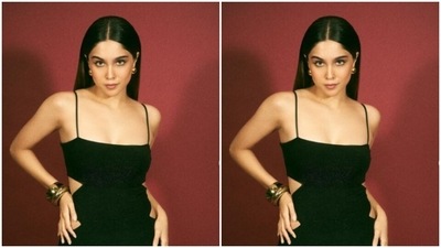Sharvari decked up in the black bodycon satin gown with slip-in details and posed for the cameras. The gown featured cut-out details throughout the sides, and hugged Sharvari’s shape perfectly. The ensemble also came with flared patterns at the ankles. (Instagram/@sharvari) Sharvari decked up in the black bodycon satin gown with slip-in details and posed for the cameras. The gown featured cut-out details throughout the sides, and hugged Sharvari’s shape perfectly. The ensemble also came with flared patterns at the ankles. (Instagram/@sharvari)