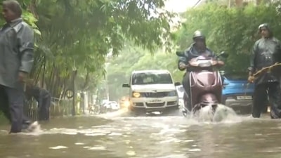 ehicles were seen moving on the flooded roads and commuters were seen wearing raincoats as they passed by. (ANI)