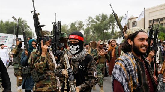 Taliban fighters celebrate the first anniversary of the fall of Kabul on a street in Kabul, Afghanistan (REUTERS) Taliban fighters celebrate the first anniversary of the fall of Kabul on a street in Kabul, Afghanistan (REUTERS)