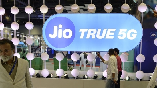 Visitors at the Reliance Jio Infocomm Ltd. booth at India Mobile Congress 2022 exhibition in New Delhi. (Bloomberg)