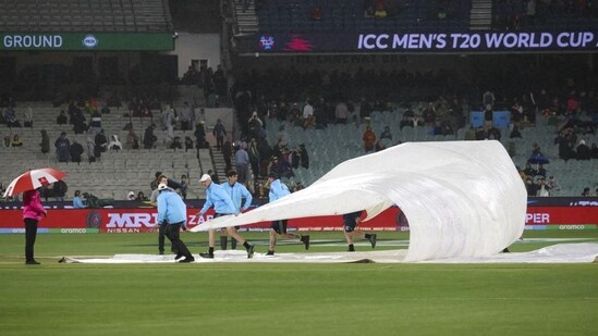 File photo of groundstaff trying to cover the MCG pitch during a T20 World Cup match(AP)