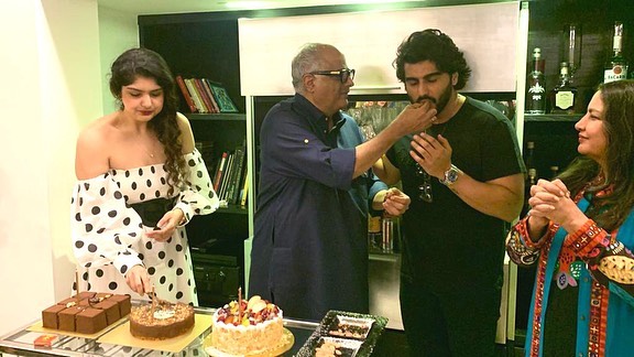 Boney Kapoor with Arjun Kapoor and Anshula Kapoor during his midnight birthday party. Boney Kapoor with Arjun Kapoor and Anshula Kapoor during his midnight birthday party.