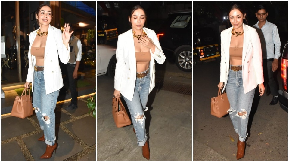 Malaika Arora donned a bralette, distressed jeans and blazer for the outing. (HT Photo/Varinder Chawla)