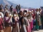 Voters showing their identity cards before casting their votes in the Himachal Pradesh assembly elections at Theog in Shimla district on Saturday. (Deepak Sansta/HT) Voters showing their identity cards before casting their votes in the Himachal Pradesh assembly elections at Theog in Shimla district on Saturday. (Deepak Sansta/HT)