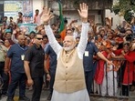 PM Modi waves to the people during a roadshow in Bengaluru. (ANI) PM Modi waves to the people during a roadshow in Bengaluru. (ANI)