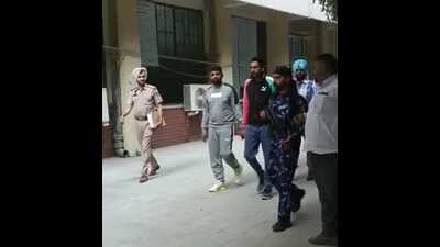 Gangsters Mandeep Toofan and Mani Rayya being produced in the court by Ludhiana police. (HT photo) Gangsters Mandeep Toofan and Mani Rayya being produced in the court by Ludhiana police. (HT photo)