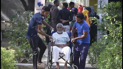 76-year-old Samay Ram leaves in a wheelchair after casting his vote at a polling station during the Haryana Panchayat elections at the Government Primary School in Gairatpur Bas village, in Gurugram, India, on November 12. (Parveen Kumar/ HT Photo) 76-year-old Samay Ram leaves in a wheelchair after casting his vote at a polling station during the Haryana Panchayat elections at the Government Primary School in Gairatpur Bas village, in Gurugram, India, on November 12. (Parveen Kumar/ HT Photo)