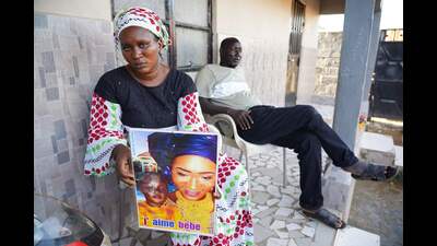 Mariama Kuyateh, 30, holds up a picture of her son Musa, who died of acute kidney failure, in Banjul on October 10, 2022. Gambian police have announced an investigation into four cough syrups made by the Indian Pharma company Maiden Pharmaceuticals, after the WHO said they could be responsible for the deaths of 66 Gambian children, most under five years old. (Milan Berckmans/AFP) Mariama Kuyateh, 30, holds up a picture of her son Musa, who died of acute kidney failure, in Banjul on October 10, 2022. Gambian police have announced an investigation into four cough syrups made by the Indian Pharma company Maiden Pharmaceuticals, after the WHO said they could be responsible for the deaths of 66 Gambian children, most under five years old. (Milan Berckmans/AFP)