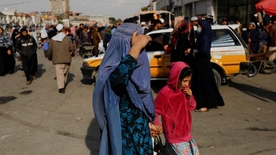 An Afghan woman and a girl walk in a street in Kabul, Afghanistan. (Representational image) (REUTERS)