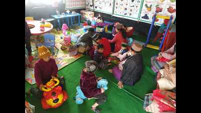 Children playing at one of the childcare facilities set up at a pink booth in Kalpa. (HT Photo) Children playing at one of the childcare facilities set up at a pink booth in Kalpa. (HT Photo)