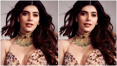 Sanjana decked up in a pastel slip blouse with a plunging neckline and multicoloured floral details in resham threads. She teamed her blouse with a multicoloured skirt with patchwork details, and featuring a thigh high slit in one side.  (Instagram/@sanjanasanghi96)