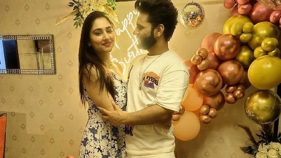 Acto Disha Parmar and her singer-husband, Rahul Vaidya, celebrated her 28th birthday on November 11. Today, the Bade Achhe Lagte Hain 2 actor took to Instagram to share snippets from her at-home celebrations. The romantic pictures show the star hugging Rahul and the two posing happily for the camera while standing in front of birthday decorations featuring balloons and a 'happy birthday' neon sign. (Instagram)