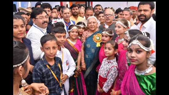 Governor Anandiben Patel with schoolchildren in Prayagraj on Saturday. (HT photo)