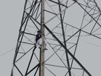 Haseeb-ul-Hasan seen atop a transmission tower. Haseeb-ul-Hasan seen atop a transmission tower.