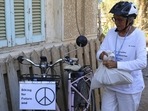 Since her arrival a week ago, Hildebrandt and her e-bike have become a fixture at the summit. (AP)