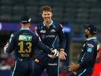 Lockie Ferguson celebrates with Gujarat Titans teammates after picking a wicket