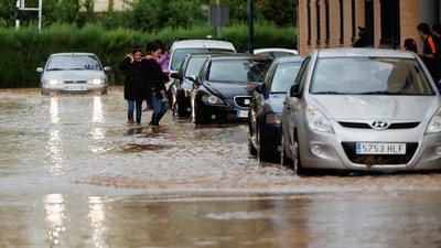 Spain Valencia Floods: People rescued from cars after floods hit Valencia, Spain. (Reuters) Spain Valencia Floods: People rescued from cars after floods hit Valencia, Spain. (Reuters)