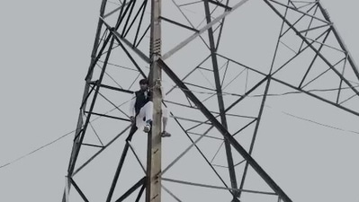 Haseeb-ul-Hasan seen atop a transmission tower. Haseeb-ul-Hasan seen atop a transmission tower.