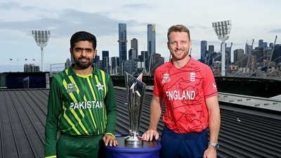 Babar Azam and Jos Buttler with the T20 World Cup trophy (ICC Twitter) Babar Azam and Jos Buttler with the T20 World Cup trophy (ICC Twitter)