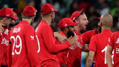 England's Jos Buttler, third right, celebrates with teammates after defeating Pakistan in the final of the T20 World Cup at the Melbourne Cricket Ground in Melbourne. (AP) England's Jos Buttler, third right, celebrates with teammates after defeating Pakistan in the final of the T20 World Cup at the Melbourne Cricket Ground in Melbourne. (AP)