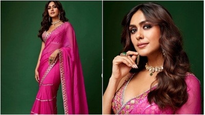 Mrunal Thakur is an absolute fashionista. The actor keeps slaying fashion goals on a daily basis with snippets from her best-dressed diaries. From six yards of grace to gowns, Mrunal can make any attire look better. On Sunday, Mrunal ditched casual ensembles and picked a sheer pink saree to get into Sushmita Sen mood from Main Hoon Naa. (Instagram/@mrunalthakur) Mrunal Thakur is an absolute fashionista. The actor keeps slaying fashion goals on a daily basis with snippets from her best-dressed diaries. From six yards of grace to gowns, Mrunal can make any attire look better. On Sunday, Mrunal ditched casual ensembles and picked a sheer pink saree to get into Sushmita Sen mood from Main Hoon Naa. (Instagram/@mrunalthakur)
