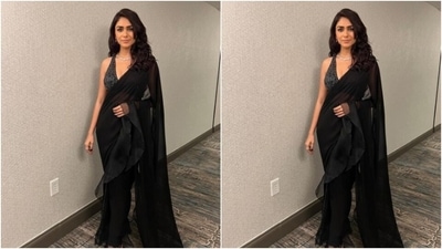 Mrunal teamed the saree with a matching black blouse with silver sari details and a diamond neck choker. (Instagram/@mrunalthakur) Mrunal teamed the saree with a matching black blouse with silver sari details and a diamond neck choker. (Instagram/@mrunalthakur)