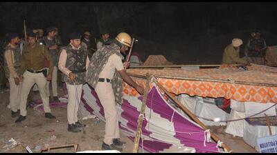 Police personnel removing the tents put up by protesters from the Jhuriwala dumping ground in Panchkula on Sunday. (Sant Arora/HT) Police personnel removing the tents put up by protesters from the Jhuriwala dumping ground in Panchkula on Sunday. (Sant Arora/HT)