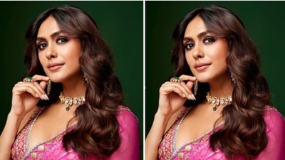 Mrunal teamed her saree with a matching pink blouse with heavy embellishments and sequin details in silver resham threads. The blouse came with sleeveless details and a plunging neckline. (Instagram/@mrunalthakur) Mrunal teamed her saree with a matching pink blouse with heavy embellishments and sequin details in silver resham threads. The blouse came with sleeveless details and a plunging neckline. (Instagram/@mrunalthakur)