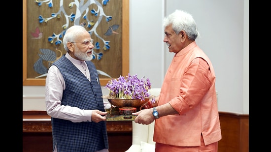 Jammu and Kashmir Lieutenant Governor Manoj Sinha meeting Prime Minister Narendra Modi in New Delhi on Sunday. (ANI/PMO Twitter)