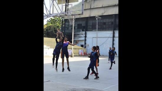 Players in action at the 37th Punjab Youth Basketball Tournament at Guru Nanak Stadium on Sunday. (Harvinder Singh/HT)