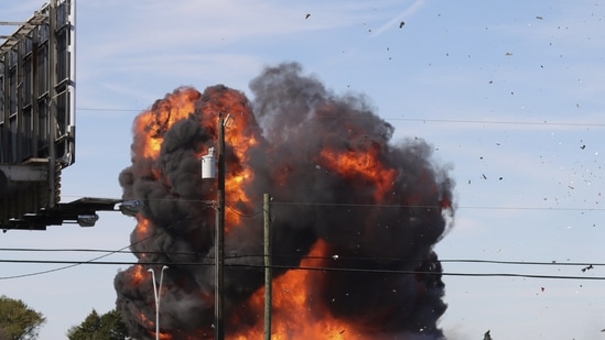 A historic military plane crashes after colliding with another plane during an airshow at Dallas Executive Airport in Dallas on Saturday,(AP)