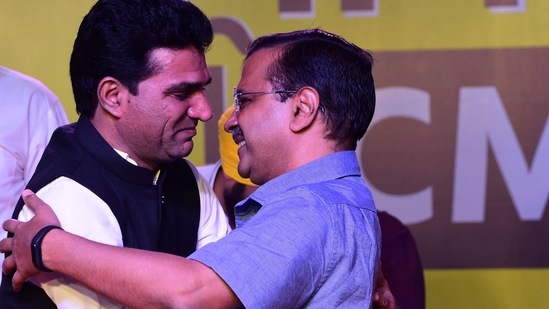 (File) Aam Aadmi Party (AAP) chief, and Delhi chief minister, Arvind Kejriwal (R) greets Isudan Gadhvi after he was named as party's chief ministerial candidate in Gujarat (AFP)