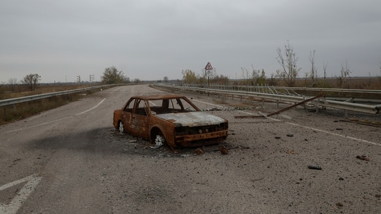 Russia-Ukraine War: Destroyed car is seen on a highway to Kherson city.(Reuters)