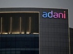 The logo of the Adani Group is seen on the facade of one of its buildings on the outskirts of Ahmedabad.