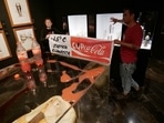 Climate activists of 'Futuro Vegetal' pose after throwing 'syrup and beetroot juice' to resemble petrol and blood at the Egyptian Museum in Barcelona, Spain.