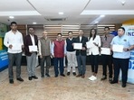 L to R: Om Prakash Karhana, Bajrang Lal, additional returning officer Tapas Bhattacharya, returning officer Umesh Sinha, Shlok Chandra, advocate IOA, Shiva Keshavan, PV Sindhu, Sharath Kamal and Gagan Narang at JLN stadium.