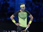 Spain's Rafael Nadal reacts after missing a point against United States' Taylor Fritz during their singles tennis match of the ATP World Tour Finals(AP) Spain's Rafael Nadal reacts after missing a point against United States' Taylor Fritz during their singles tennis match of the ATP World Tour Finals(AP)