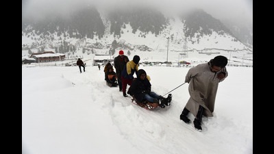 Tourists enjoying a sledge ride after fresh snowfall at Sonamarg in north Kashmir's Ganderbal district, on Monday. (Waseem Andrabi /ht) Tourists enjoying a sledge ride after fresh snowfall at Sonamarg in north Kashmir's Ganderbal district, on Monday. (Waseem Andrabi /ht)