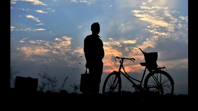 A man takes a break on his way back home on a cloudy evening in Ludhiana. (Gurpreet Singh/HT)