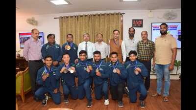 The NCR gymnastics team with NCR GM and other officials in Prayagraj on Monday. (HT Photo)