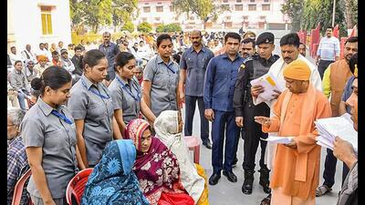 Uttar Pradesh chief minister Yogi Adityanath listens to the problems of the general public during ‘Janta Darshan’ programme, in Gorakhpur, Monday. (PTI Photo)