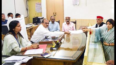 Samajwadi Party candidate Dimple Yadav filing her nomination for the Mainpuri Lok Sabha bypoll in the presence of her husband, SP chief Akhilesh Yadav. (PTI PHOTO) Samajwadi Party candidate Dimple Yadav filing her nomination for the Mainpuri Lok Sabha bypoll in the presence of her husband, SP chief Akhilesh Yadav. (PTI PHOTO)