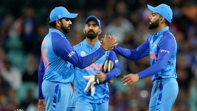 Rohit Sharma, left, and Virat Kohli shake hands after the T20 World Cup cricket match between India and the Netherlands in Sydney (AP)
