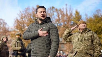Ukrainian President Volodymyr Zelenskyy listens to the national anthem during his visit to Kherson, Ukraine, on November 14. (AP) Ukrainian President Volodymyr Zelenskyy listens to the national anthem during his visit to Kherson, Ukraine, on November 14. (AP)